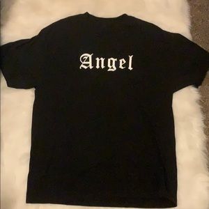 A black oversized tee angle font and wings